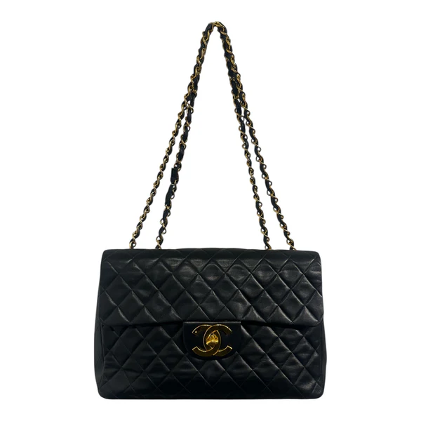 1990s Chanel Jumbo Classic Flap in Black Lambskin with 24kt gold plated hardware.