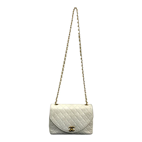 1980s Chanel White Lambskin Diana Flap Bag with 24K gold hardware from Karl Lagerfeld era.